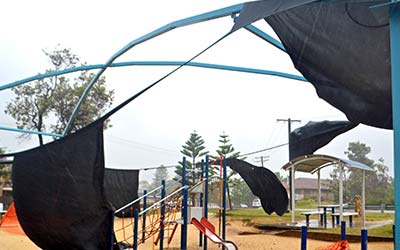 playground awning with torn shade